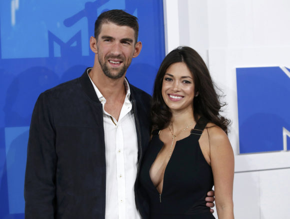 Olympic swimmer Michael Phelps and fiance Nicole Johnson arrive at the 2016 MTV Video Music Awards in New York, U.S., August 28, 2016. REUTERS/Eduardo Munoz